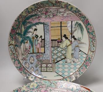 A pair of Japanese famille rose chargers and an Imari charger, largest 40.5cm diameter